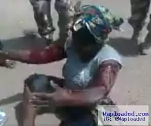 Horrible! See What Nigerian Army Did To A Woman Allegedly Caught Delivering Guns To Boko Haram [Video]